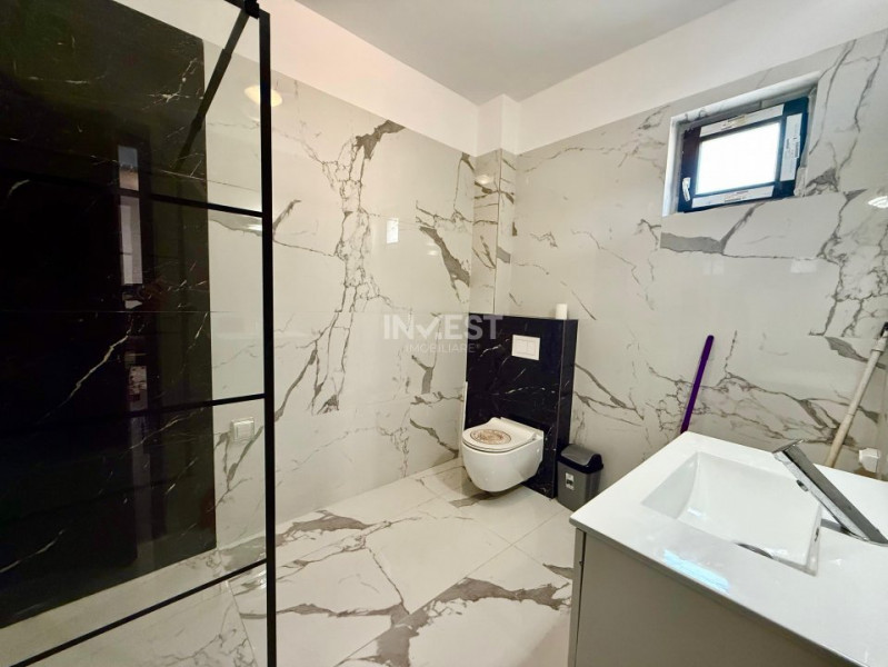 Vilă de vânzare cu design deosebit în cartierul Bucium