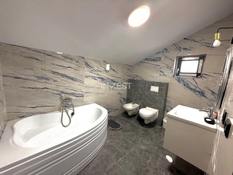Vilă de vânzare cu design deosebit în cartierul Bucium