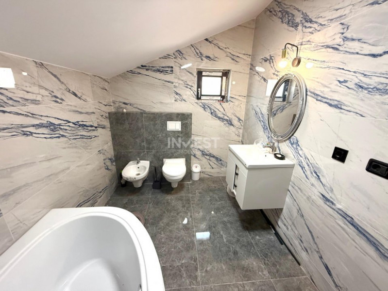 Vilă de vânzare cu design deosebit în cartierul Bucium