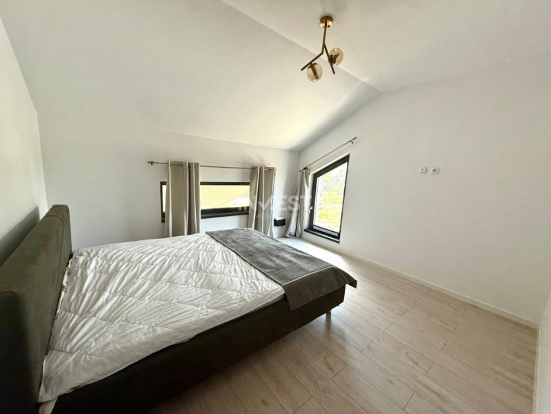 Vilă de vânzare cu design deosebit în cartierul Bucium