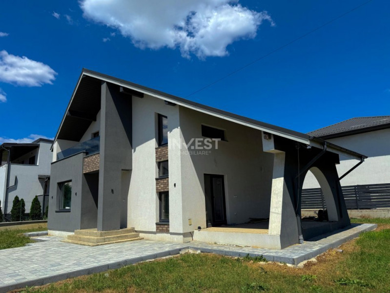Vilă de vânzare cu design deosebit în cartierul Bucium